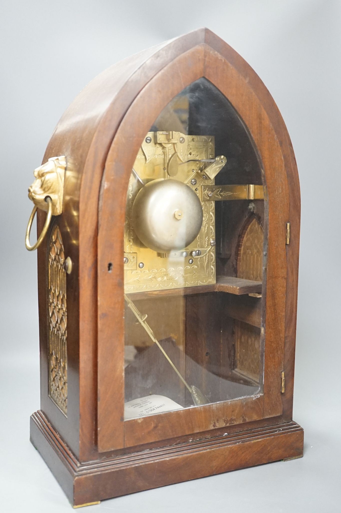 An early 19th century lancet shape mahogany mantel clock, 49cm
